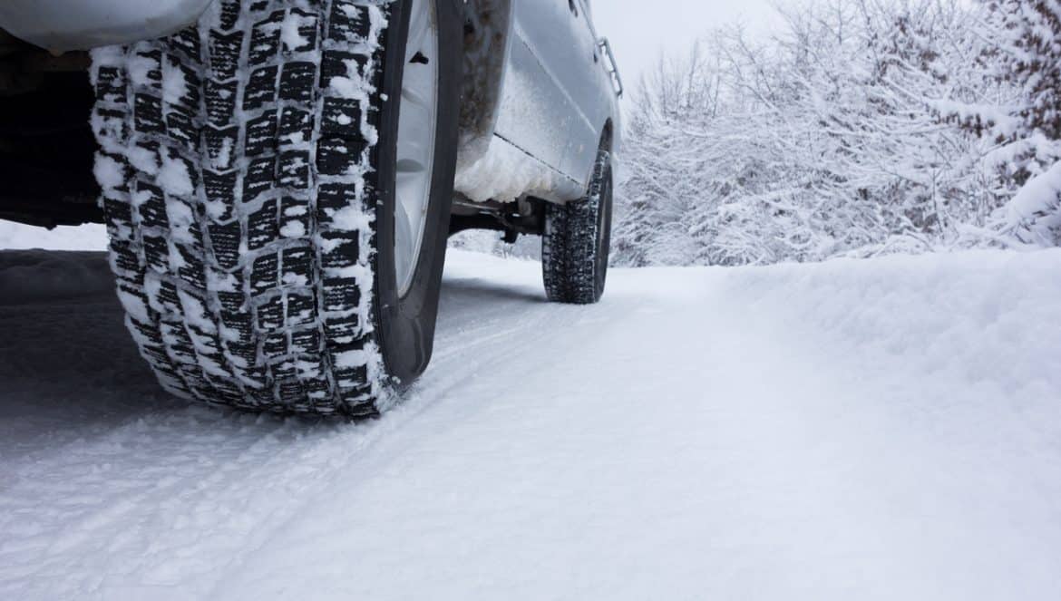 Winter Tyre on snow covered road.